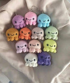 Authentic Kashmiri handmade crochet octopus keychain set in multiple colors including purple pink blue orange green yellow white on white fabric background Pakistan