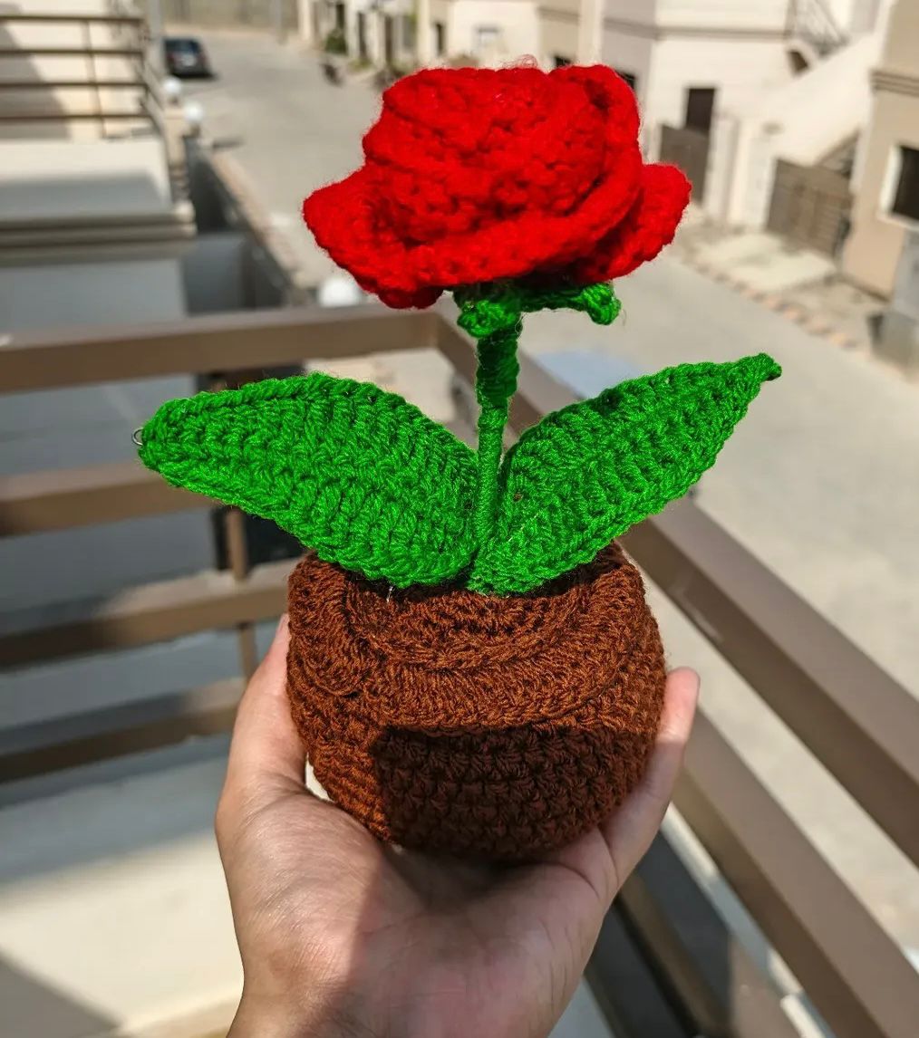 A single royal red rose handmade crochet mini potted plant.