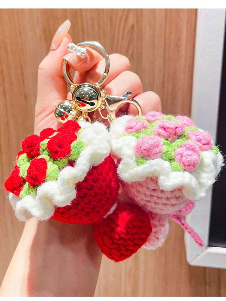 Miniature handmade crochet flower bouquet keychain in red and pink colors with green leaves, aesthetic bag accessory.