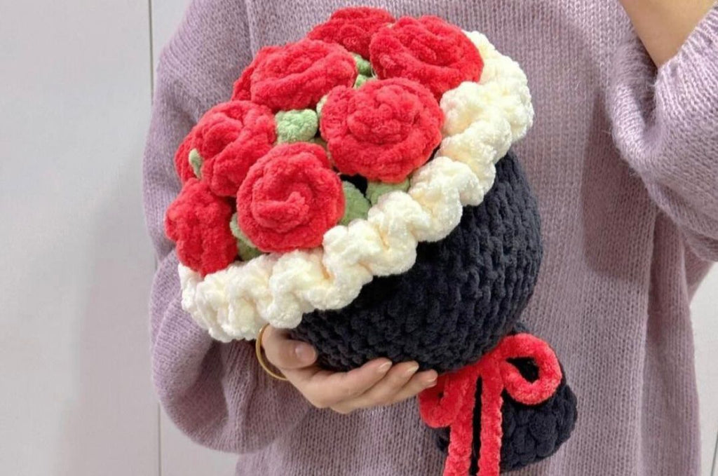 A large premium Kashmiri handmade crochet bouquet of red roses wrapped in black and white yarn.