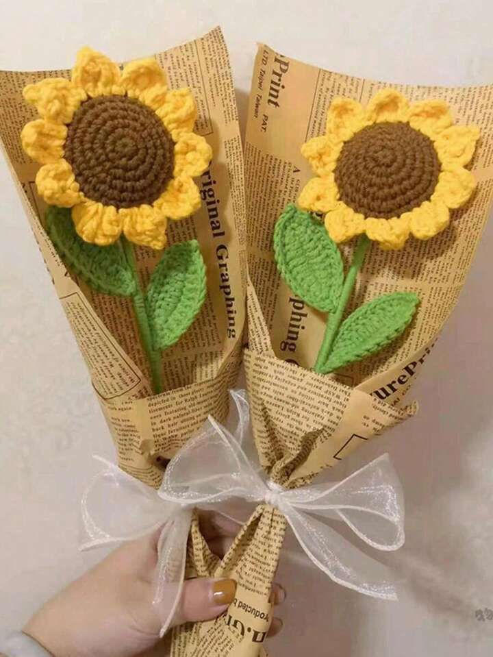 A beautiful Kashmiri handmade crochet sunflower bouquet wrapped in vintage newspaper print with a white bow.